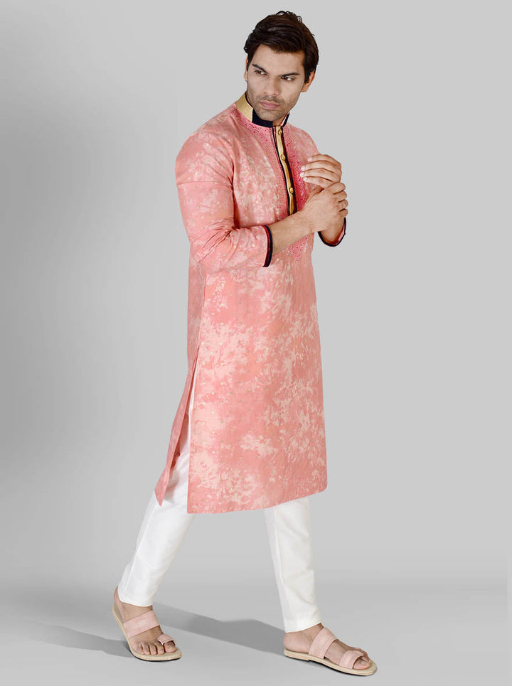 Celebrate in vibrant style with our pink silk kurta pajama set, perfect for enhancing your wardrobe.