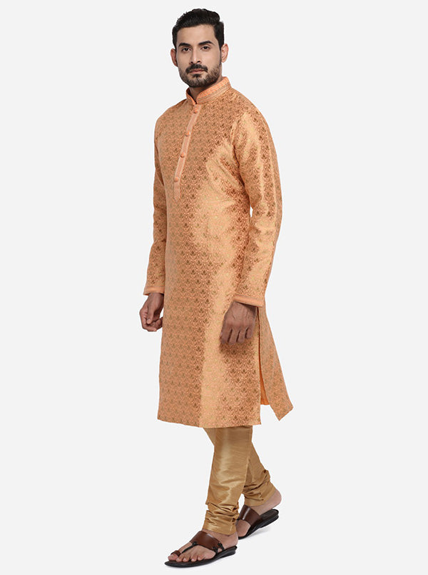 Elevate your ethnic wardrobe with this self-design light orange and golden kurta set, ideal for the USA fashion scene.