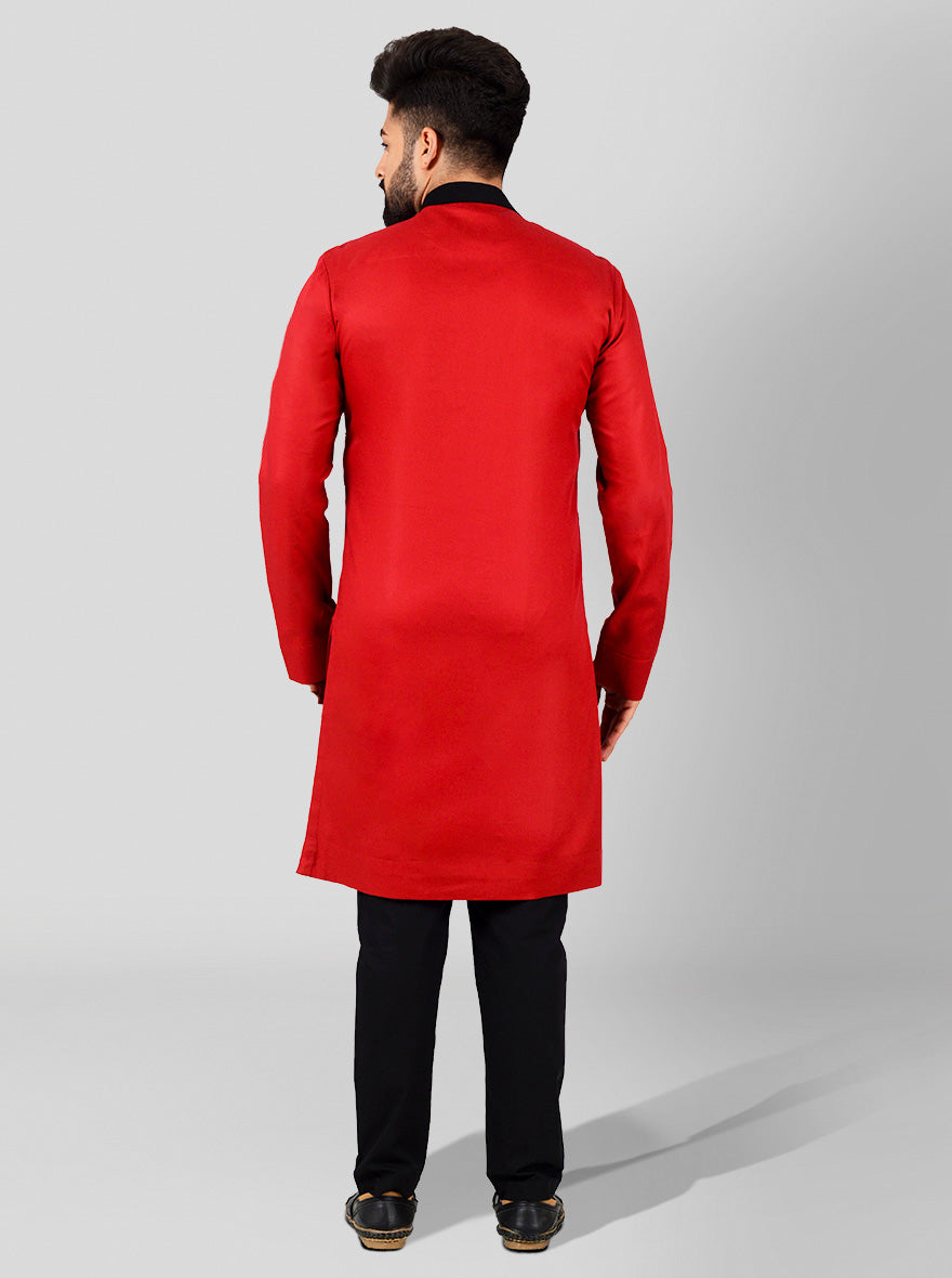 Comfortable red kurta made of cotton satin, showcasing shoulder buttons and pleated detailing, suitable for festive events.