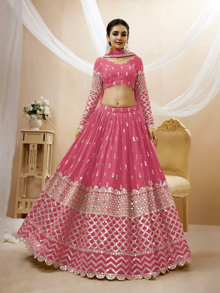 Stunning pink georgette lehenga choli set with intricate sequins and zari work, perfect for weddings and celebrations.