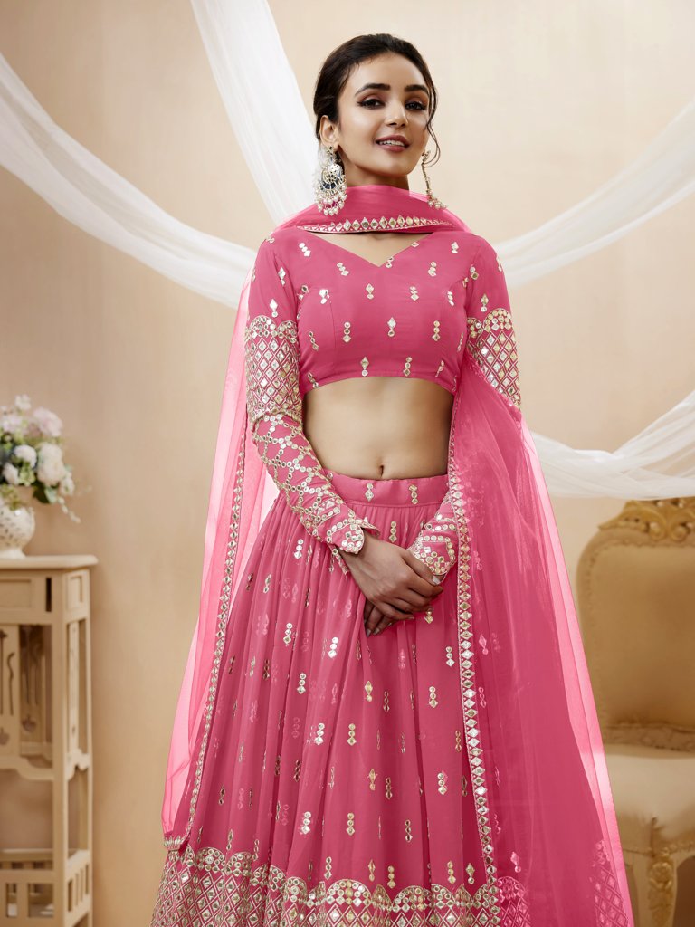 Gorgeous pink georgette lehenga choli featuring intricate sequins and zari designs, perfect for weddings.