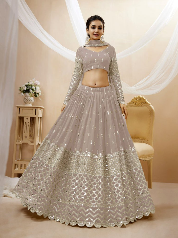 Elegant grey georgette lehenga choli with delicate sequins and intricate zari work, perfect for bridal occasions.