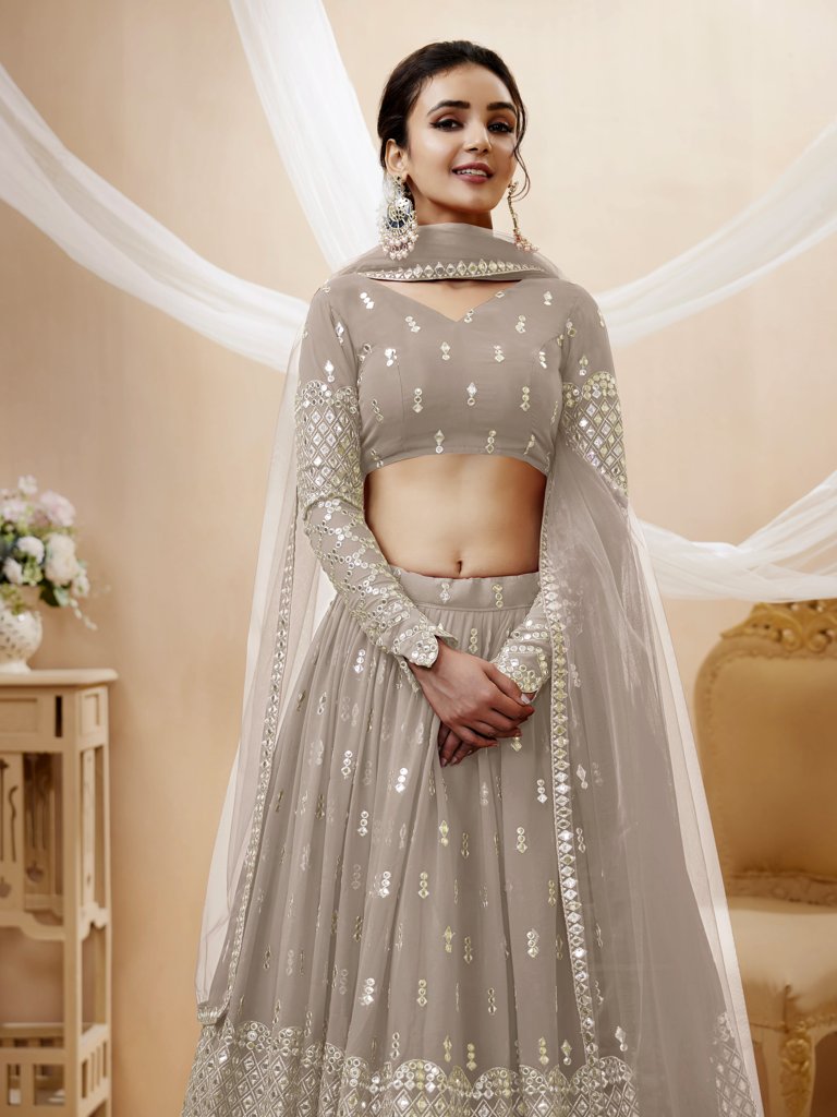 Graceful grey lehenga choli set with intricate sequins and zari embroidery, designed for cultural gatherings.