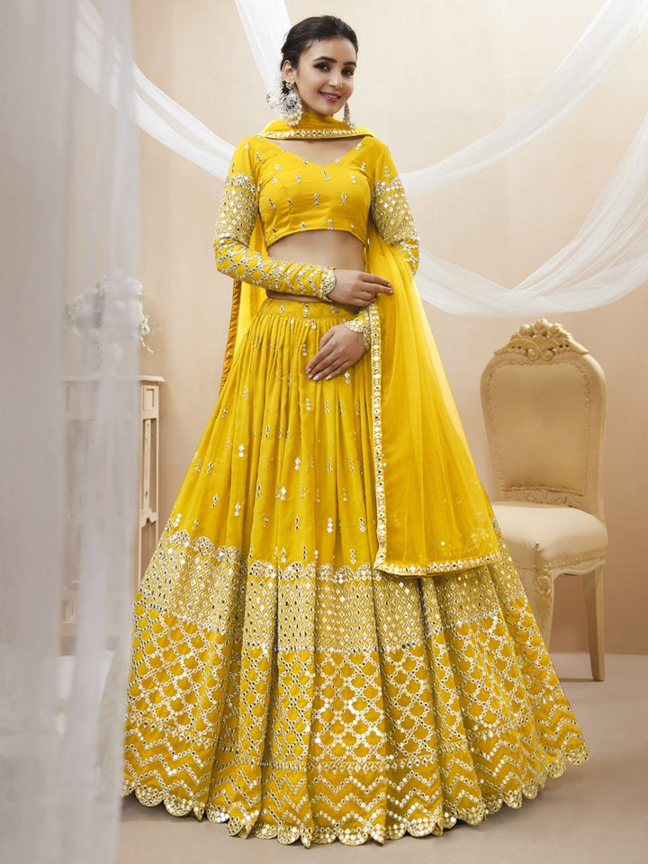 Vibrant yellow georgette lehenga choli set with sequins and zari work, perfect for festive celebrations.