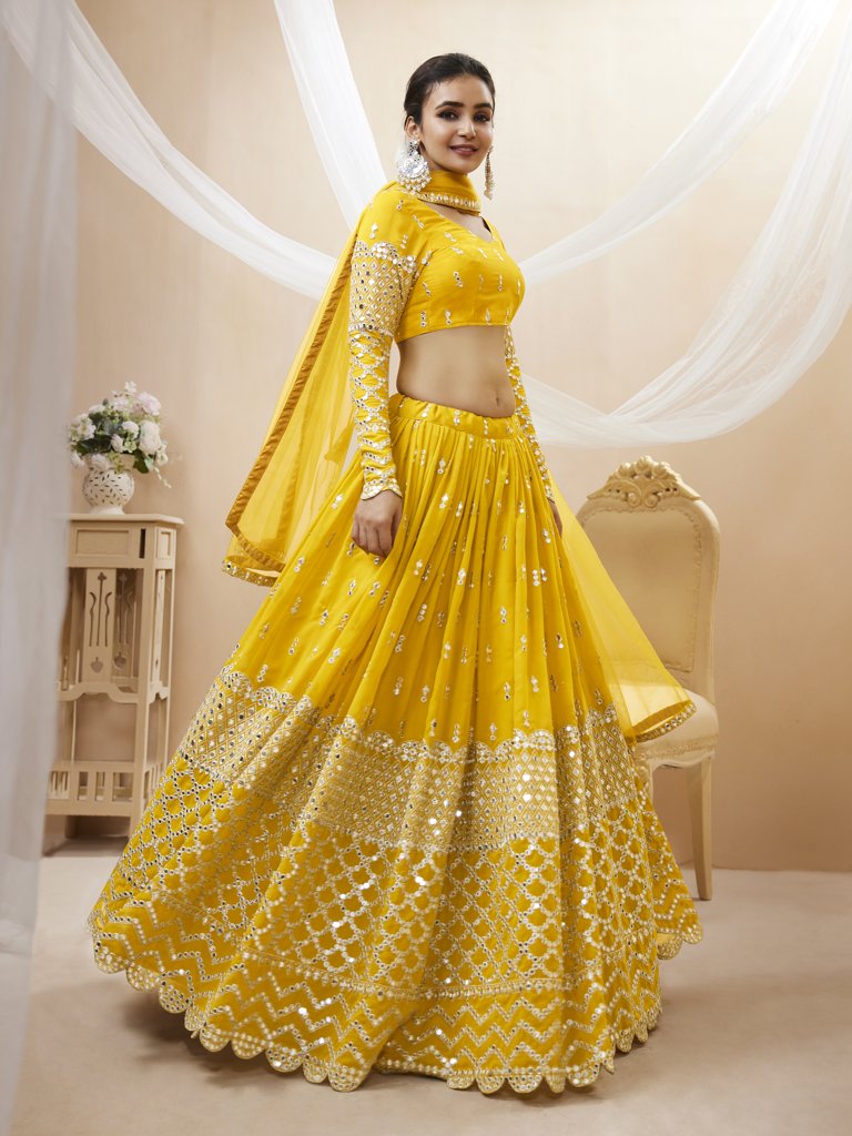 Stunning yellow georgette lehenga with sequins and zari work, perfect for traditional and cultural events.