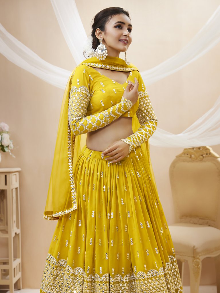 Elegant yellow lehenga choli set with exquisite sequins and zari embroidery, designed for bridal wear.