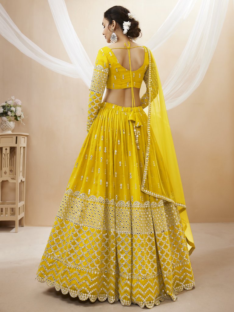 Gorgeous yellow lehenga choli in georgette with intricate sequins and zari detailing, ideal for weddings.