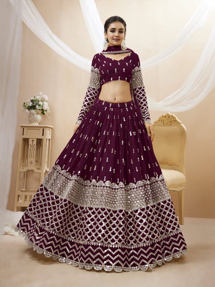 Elegant wine georgette lehenga choli set with intricate sequins and zari embroidery, perfect for weddings.