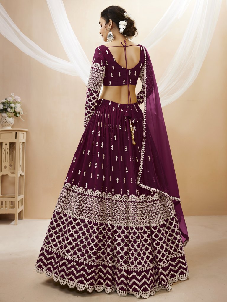 Stunning wine georgette lehenga set featuring sequins and zari designs for a luxurious bridal look.