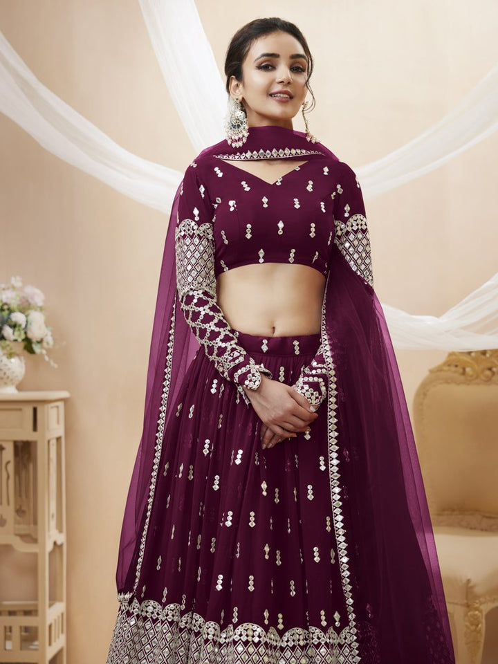 Graceful wine georgette lehenga with sequins and zari detailing, designed for elegant weddings and parties.