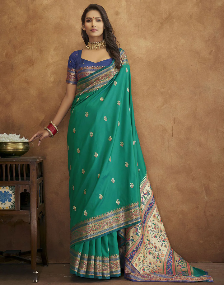 Elegant green Pethani silk saree with gold zari detailing and Meenakari border for cultural celebrations.