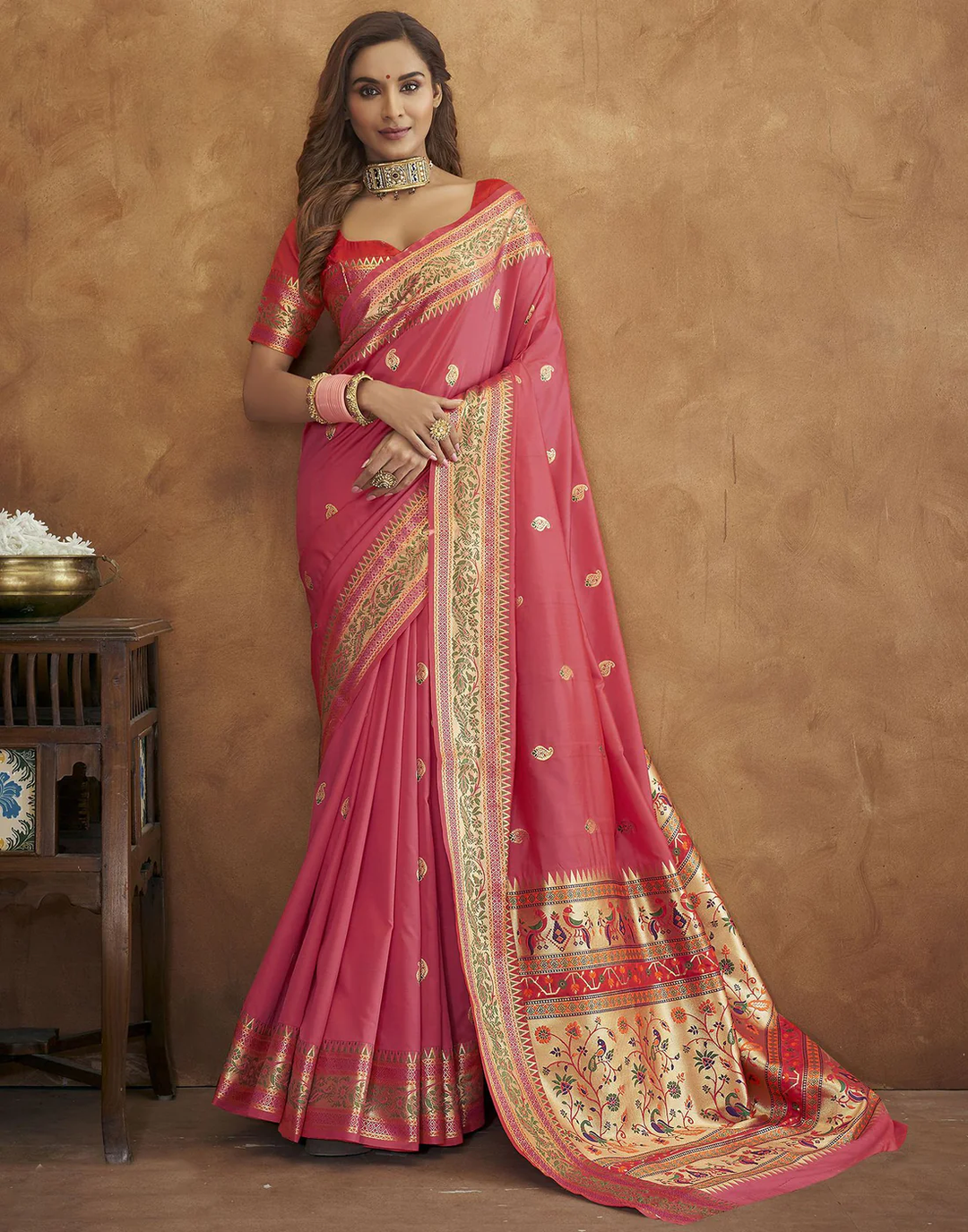 Elegant pink Pethani silk saree featuring gold zari detailing and Meenakari border for festive occasions.