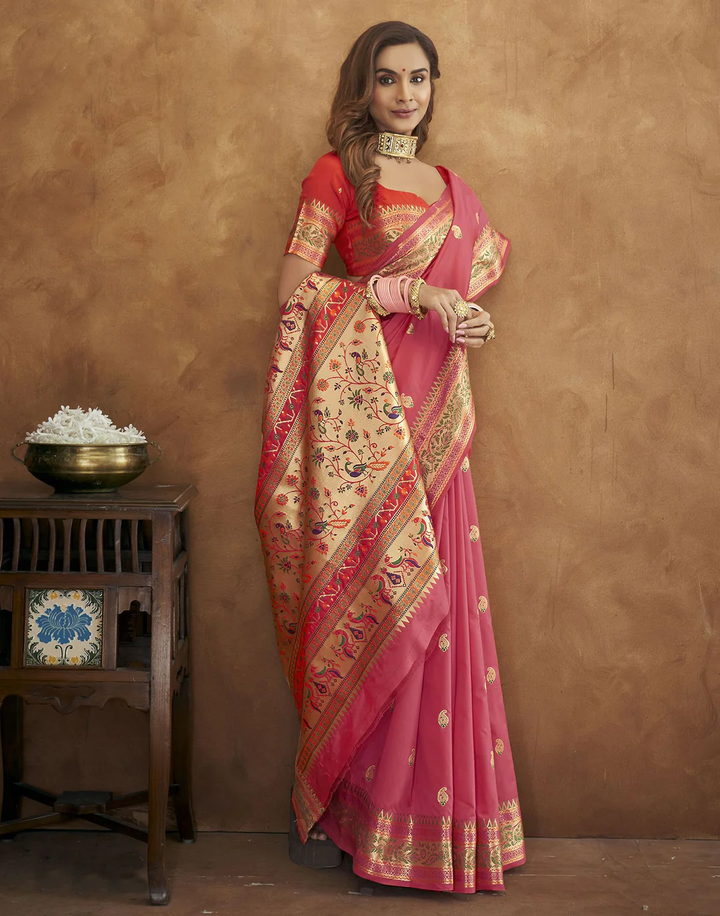 Stunning pink Pethani silk saree with gold zari motifs and Meenakari border for traditional celebrations.