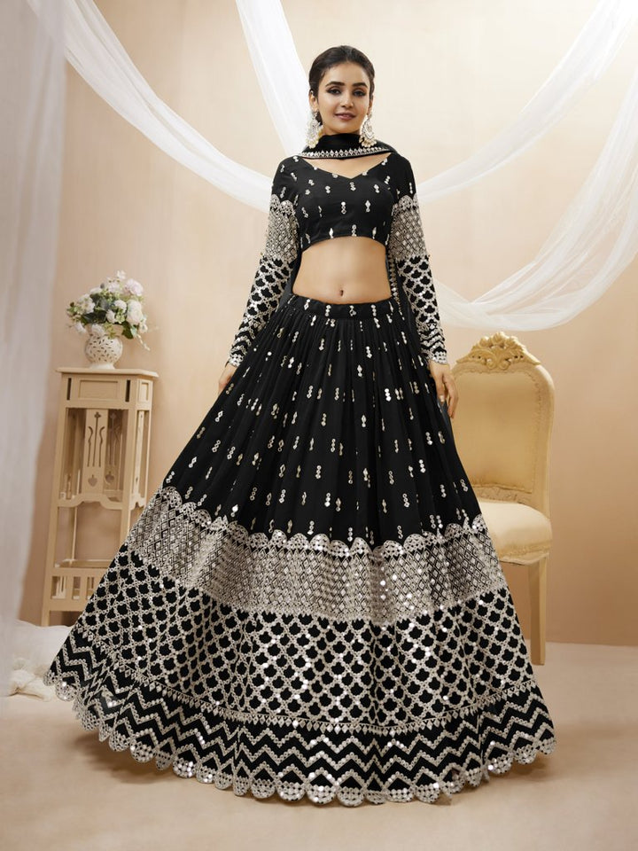 Classic black georgette lehenga choli set with sequins and zari work, perfect for weddings and celebrations.