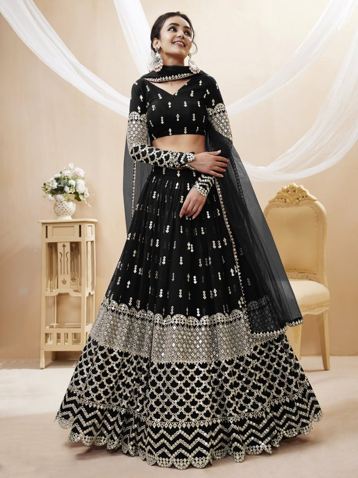 Traditional black lehenga choli set with sequins and zari work, designed for elegant bridal occasions.