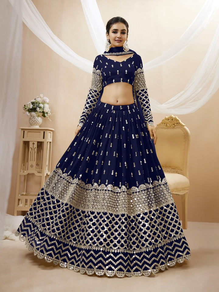 Elegant navy blue georgette lehenga choli set with intricate sequins and zari embroidery, perfect for weddings.