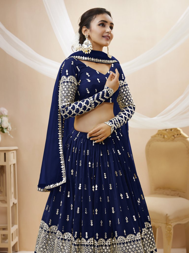 Stunning navy lehenga choli in georgette with sequins and zari work, ideal for festive and cultural celebrations.