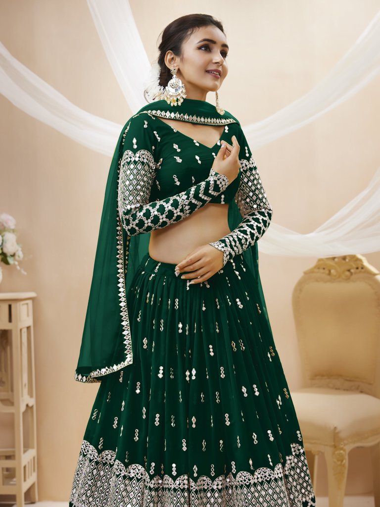 Elegant green lehenga choli in georgette with delicate sequins and zari embroidery, ideal for festive occasions.