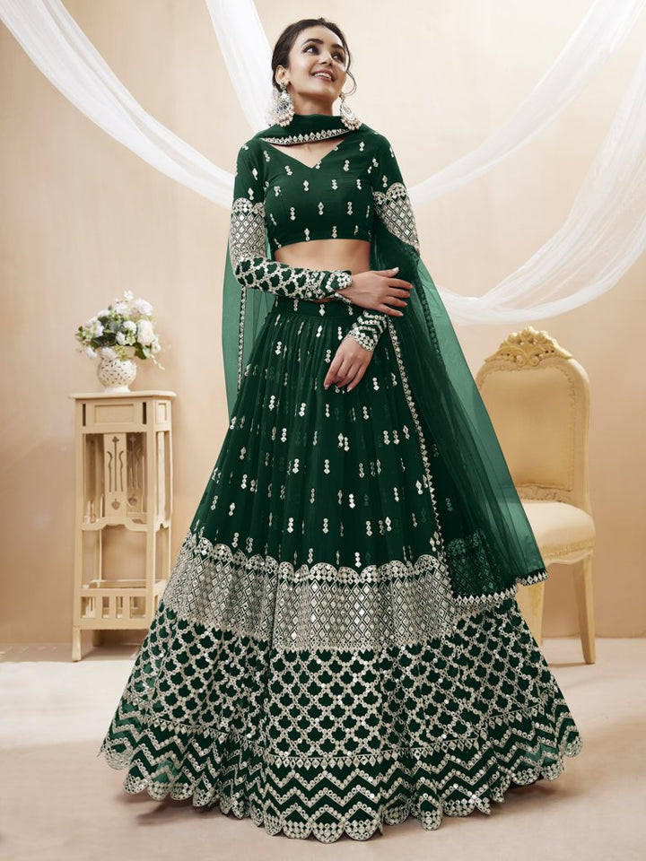 Traditional green lehenga choli set with sequins and zari work, designed for luxurious wedding celebrations.