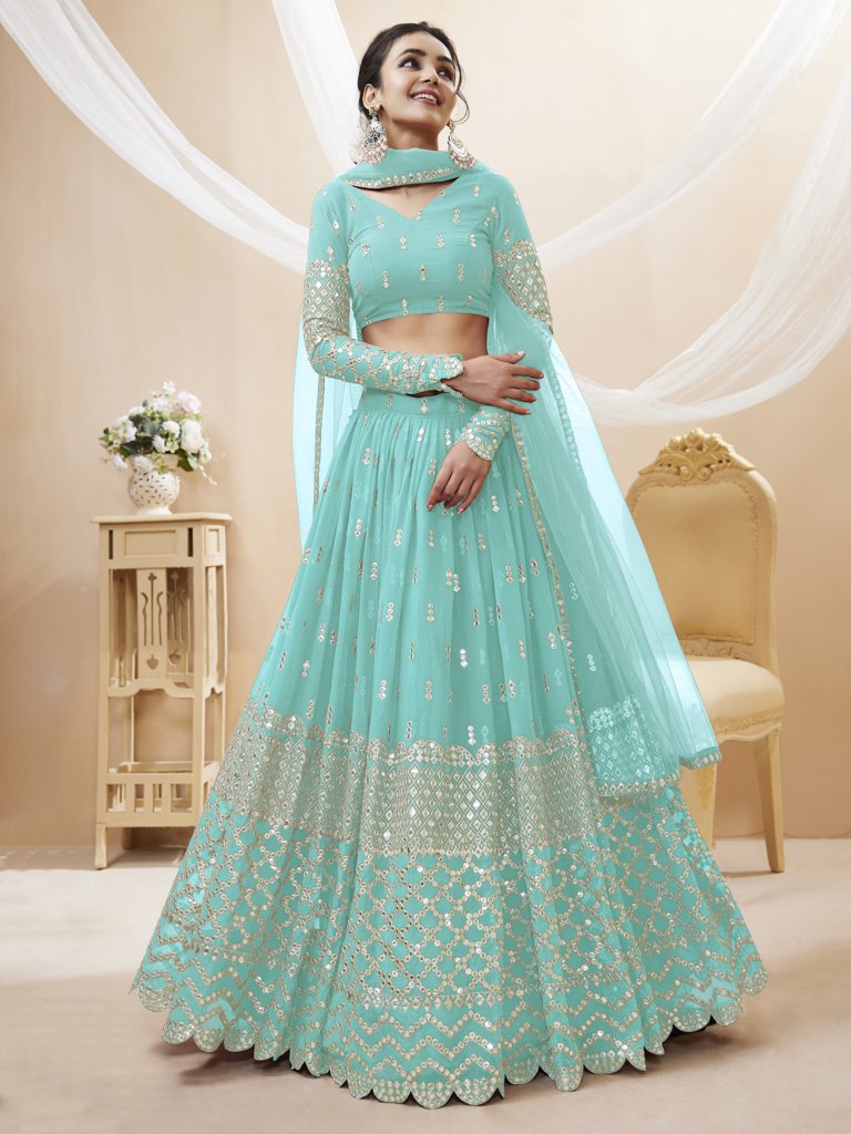 Traditional sky-blue lehenga choli with sequins and zari work, designed for elegant celebrations and gatherings.