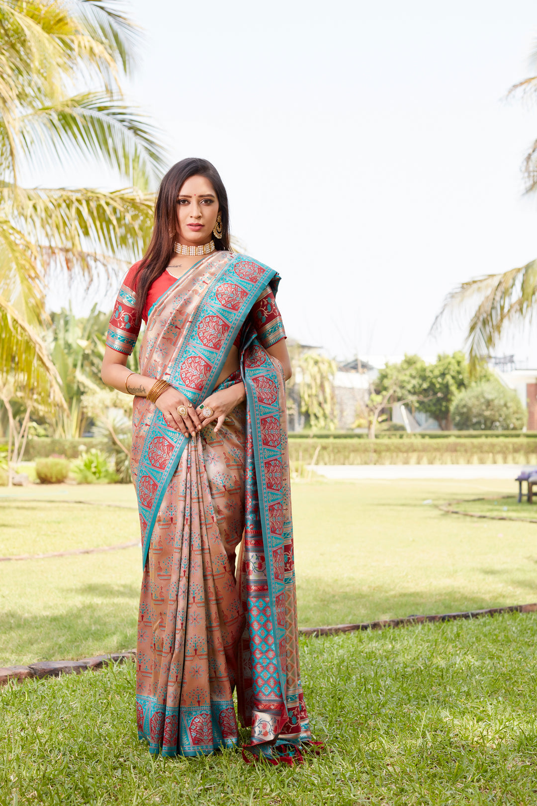 Radiant peach Kanjivaram saree with intricate work and a luxurious woven pallu, ideal for making a statement at events.