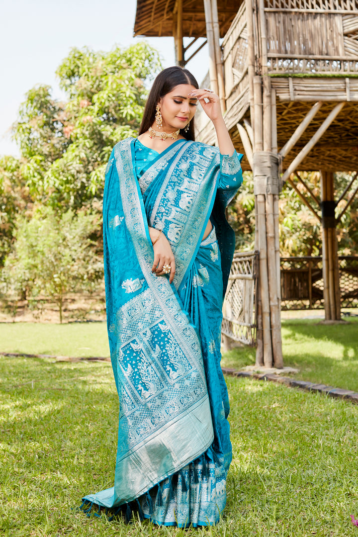 Stunning sky blue satin Kanjivaram saree featuring a gorgeous elephant border, perfect for weddings and festive occasions.