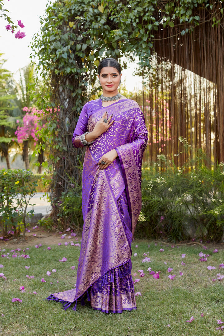 Graceful purple Kanjivaram soft satin silk saree with intricate butta work, ideal for festive and elegant celebrations.