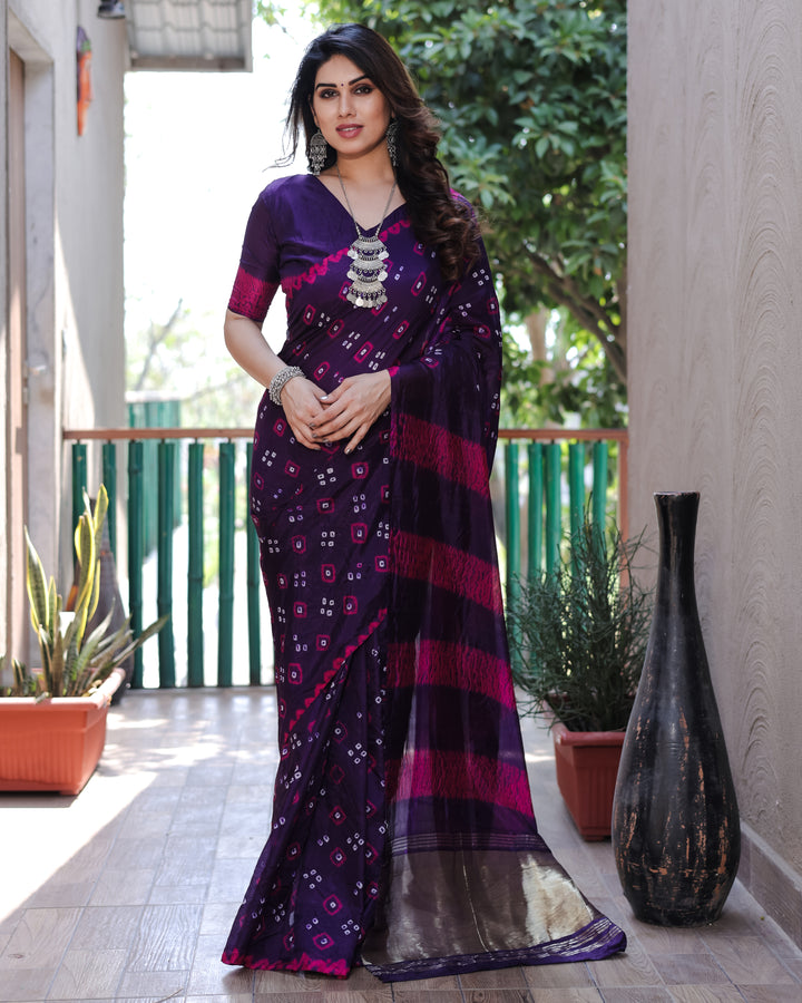 Dark purple Bandhej silk saree with exquisite Zari weaving and stunning traditional motifs, ideal for special occasions.