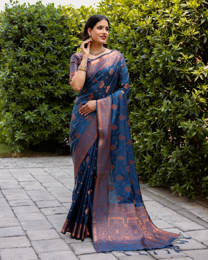 Blue soft silk saree with intricate copper weaving and contrast borders, perfect for making a statement at weddings.