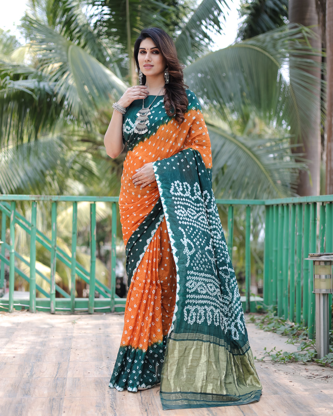 Orange Premium Bandhej Silk Drapes featuring Zari Tissue Pallu and blouse piece for a vibrant, luxurious feel.