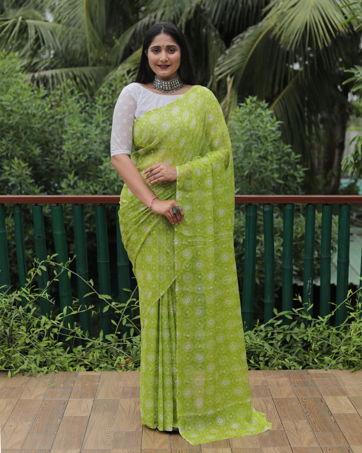 Stunning light green chiffon saree with foil detailing, exuding grace and sophistication for any event.