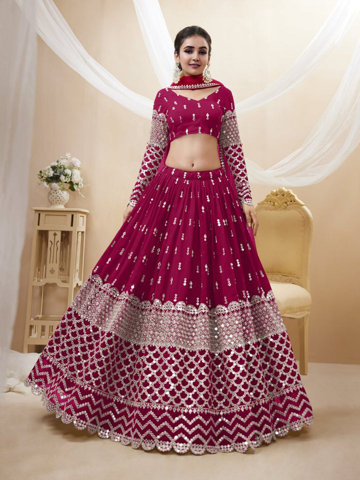 Vibrant bright-pink georgette lehenga choli set with intricate sequins and zari work, perfect for weddings.