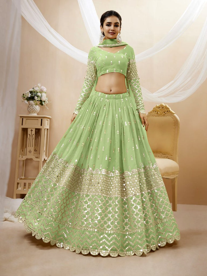 Elegant pista-green georgette lehenga choli set with intricate sequins and zari embroidery, perfect for weddings.