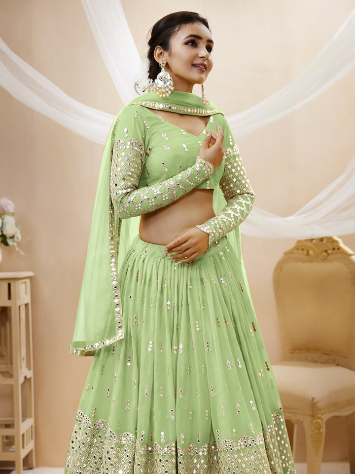 Gorgeous pista-green lehenga choli in georgette fabric with sequins and zari work, ideal for festive celebrations.