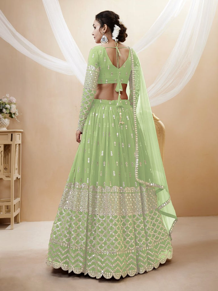 Stunning pista-green georgette lehenga set with exquisite sequins and zari work, perfect for cultural events.