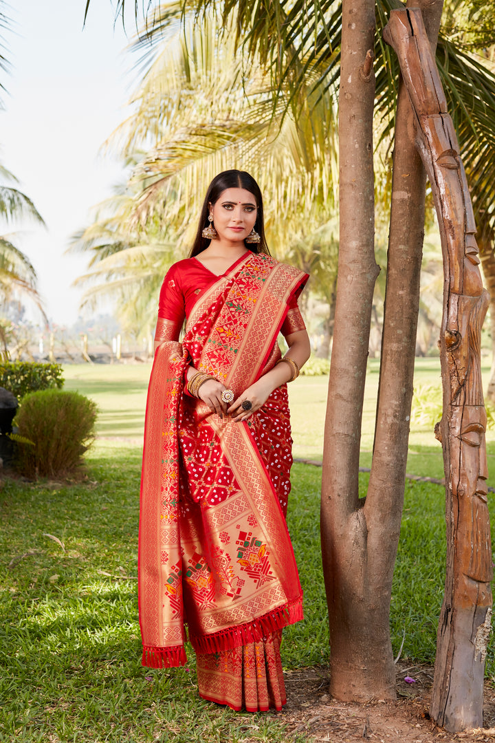 Stunning blue Gharchola Bandhej silk saree with zari weaving and meenakari borders, designed for weddings and festive occasions.