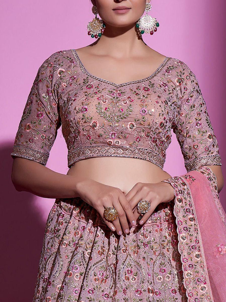 Gorgeous peach wedding lehenga with intricate sequins and embroidery.