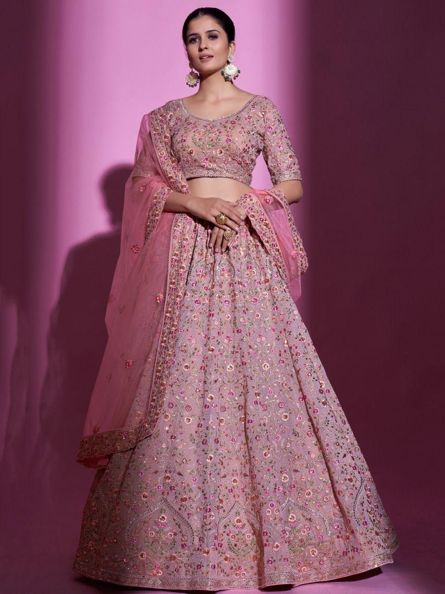 Peach georgette lehenga choli with sequins, thread, and Swarovski work.