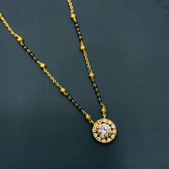 Beautiful black bead mangalsutra with gold-plated alloy, traditional design for modern women.