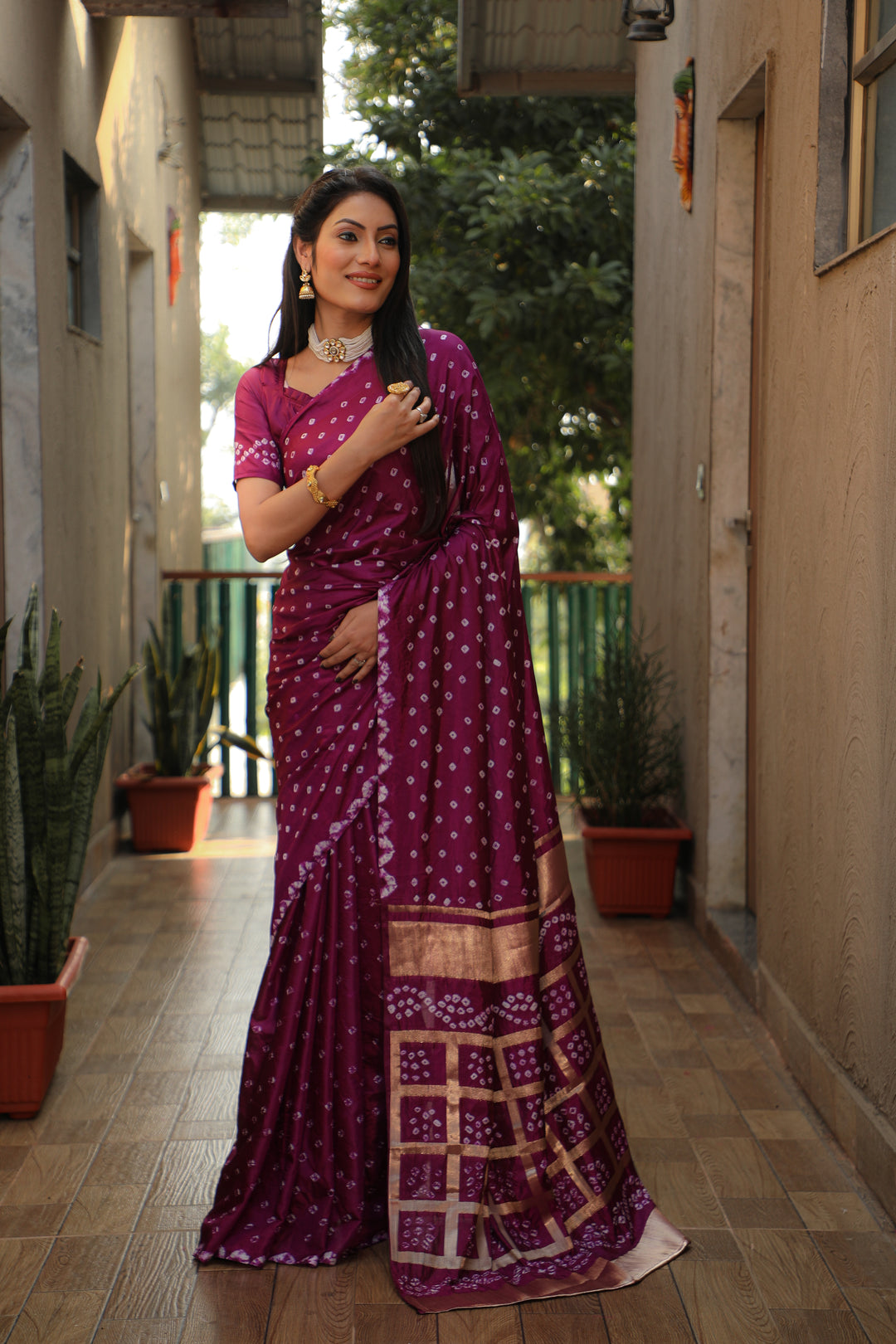 Timeless wine Bandhej silk saree with stylish checks pattern, perfect for cultural events.