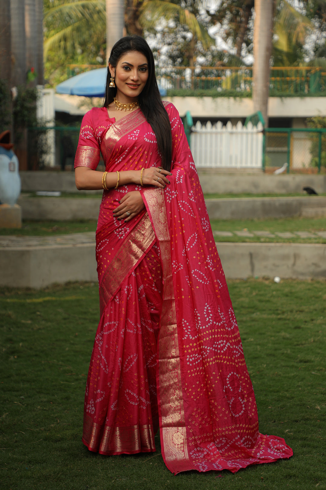 Radiant green Bandhej silk saree with intricate jari weaving and Bandhej pallu, perfect for traditional celebrations.