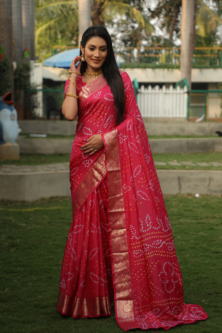 Soft pink Bandhej silk saree with a vibrant jari border and Bandhej pallu, ideal for weddings and special celebrations.