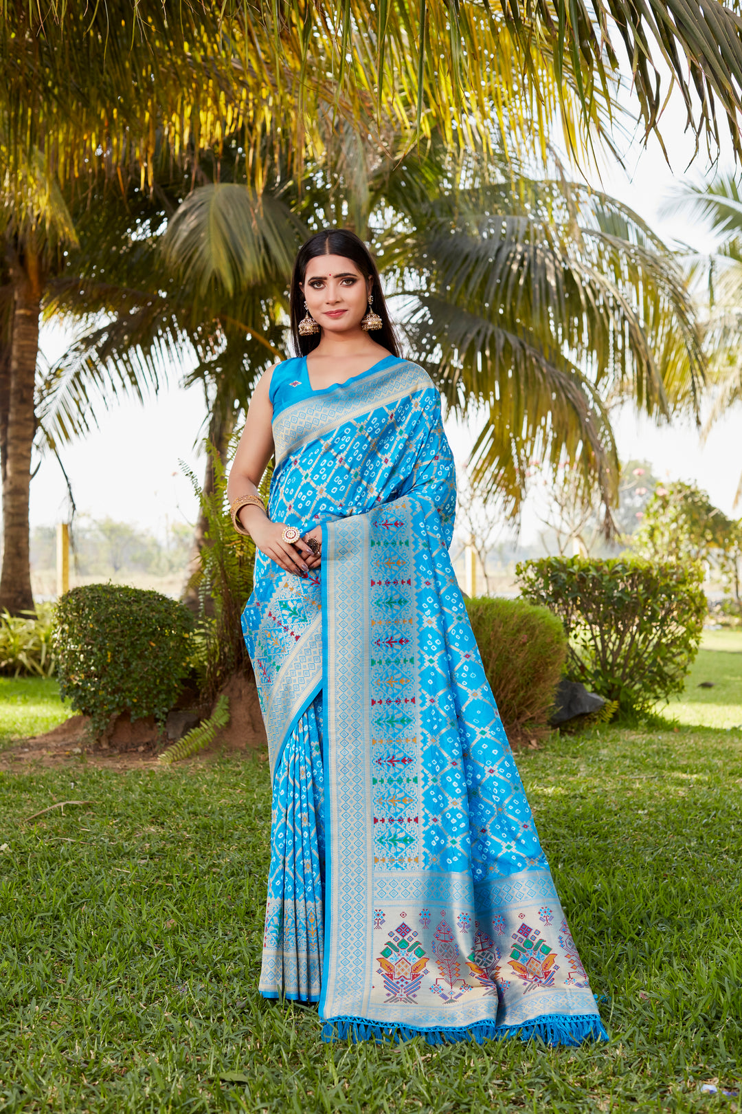 Blue Gharchola Bandhej silk saree with exquisite zari and meenakari borders, ideal for festive occasions and weddings.