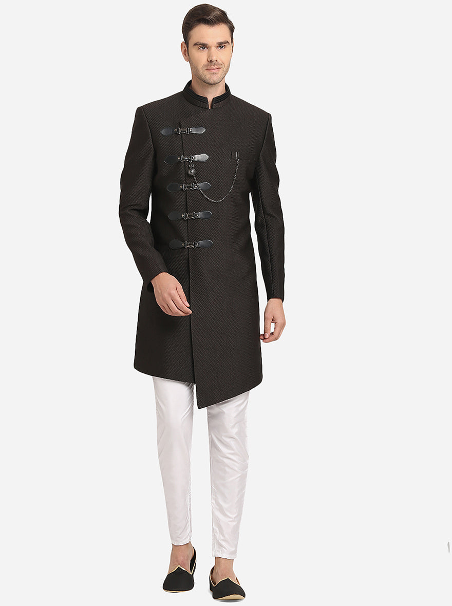 Black Indo Western dress with mandarin collar, asymmetric buttons, and churidaar for men.