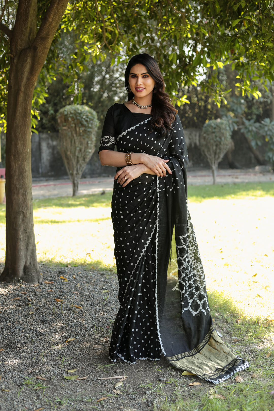 Black Premium Bandhej Silk Saree with original design and beautiful Zari weaving for weddings.