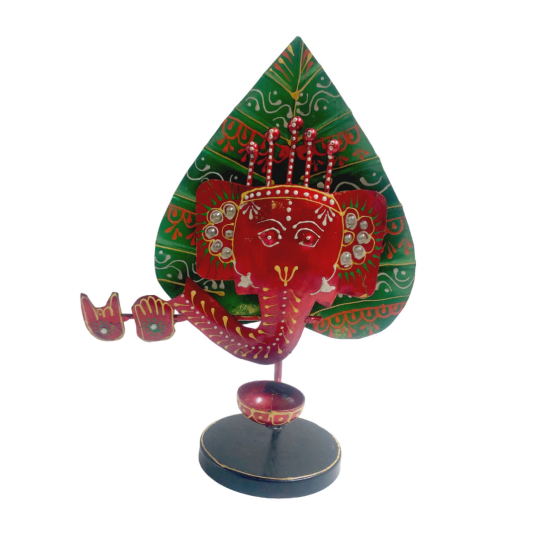 Handcrafted iron red and green Ganesha candle holder, a beautiful decorative piece