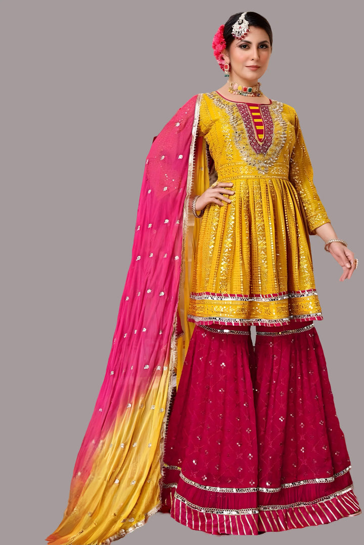 Charming yellow georgette Garara suit set with intricate multicolor design.