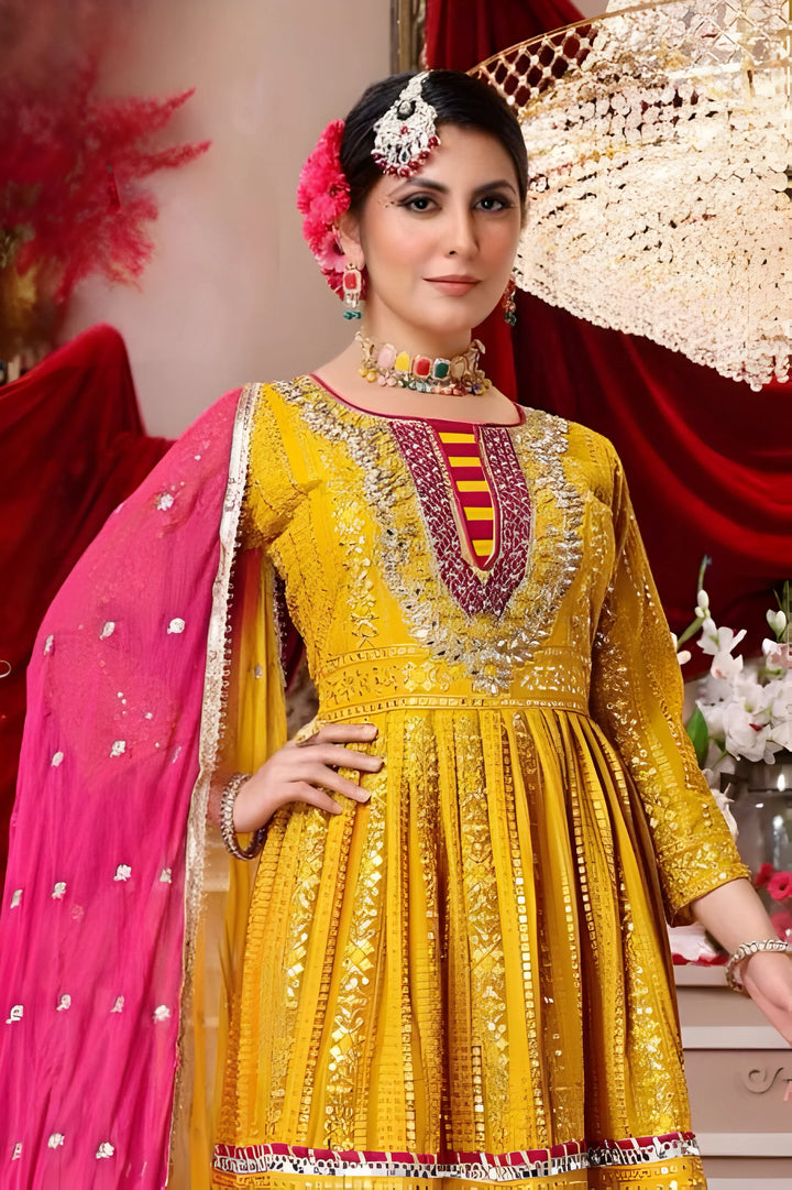 Elegant yellow Garara suit in georgette fabric featuring multicolor patterns.