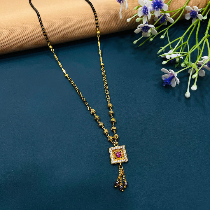 Black and gold mangalsutra in durable alloy, perfect for classic style enthusiasts.