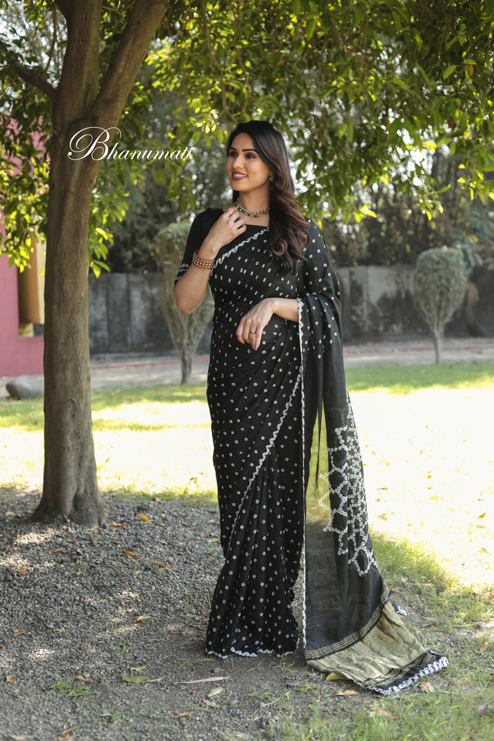 Elegant Black Bandhej Silk Saree with gorgeous Zari weaving and Pallu, perfect for upscale events.